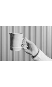 Hand holding ceramic Milk Jug, handmade by Wonki Ware in South Africa, available at Amara Home.